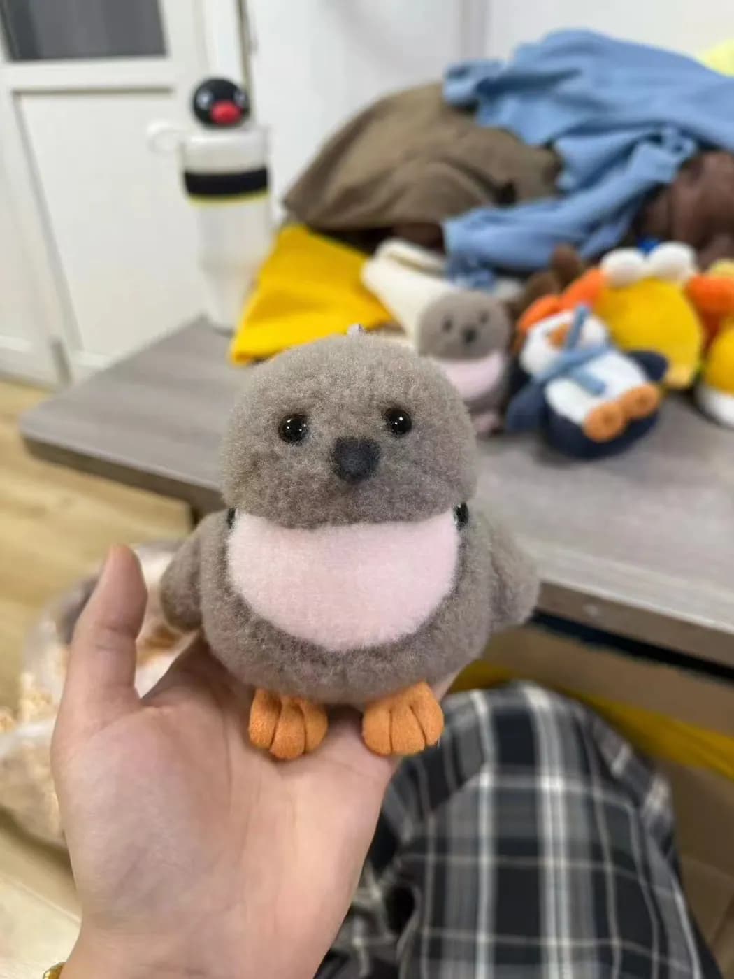 Grey seal plush toy with a soft cream belly panel