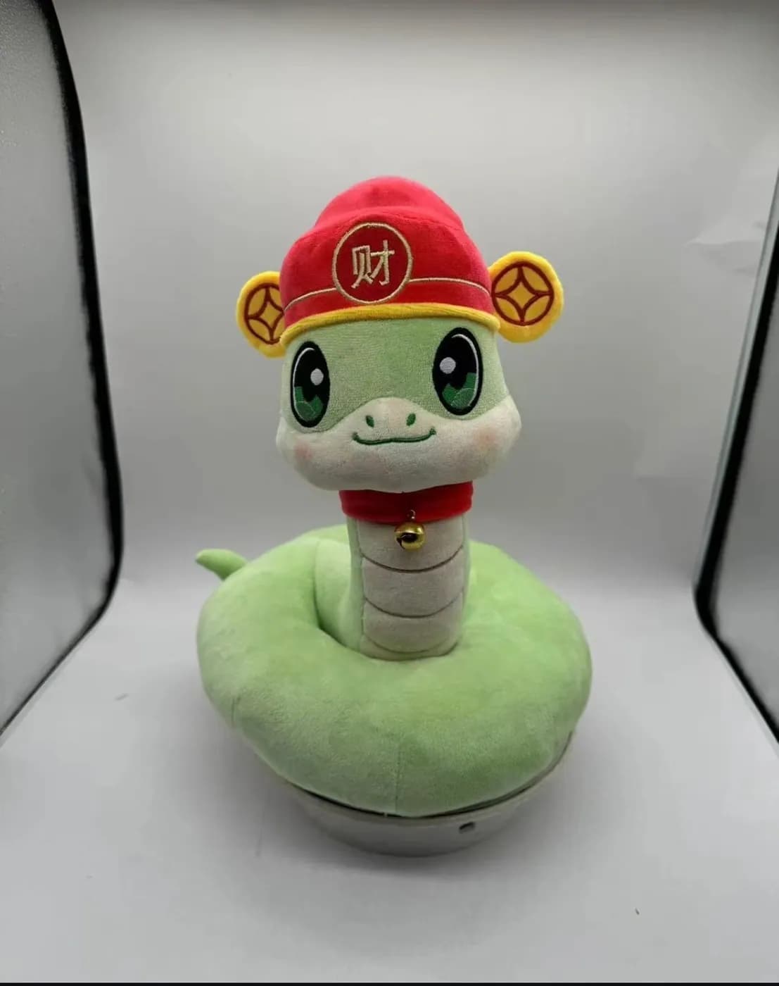 Snake plush toy with a fortune hat for a lunar new year range