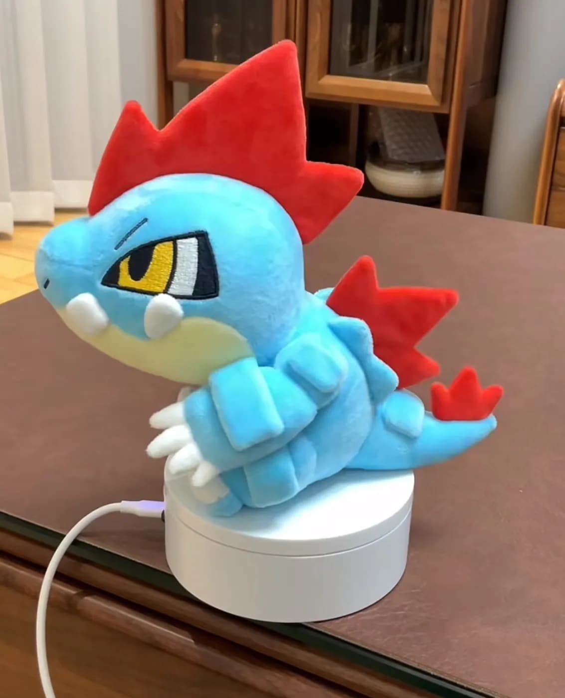 Blue dragon game character plush with red fin panels