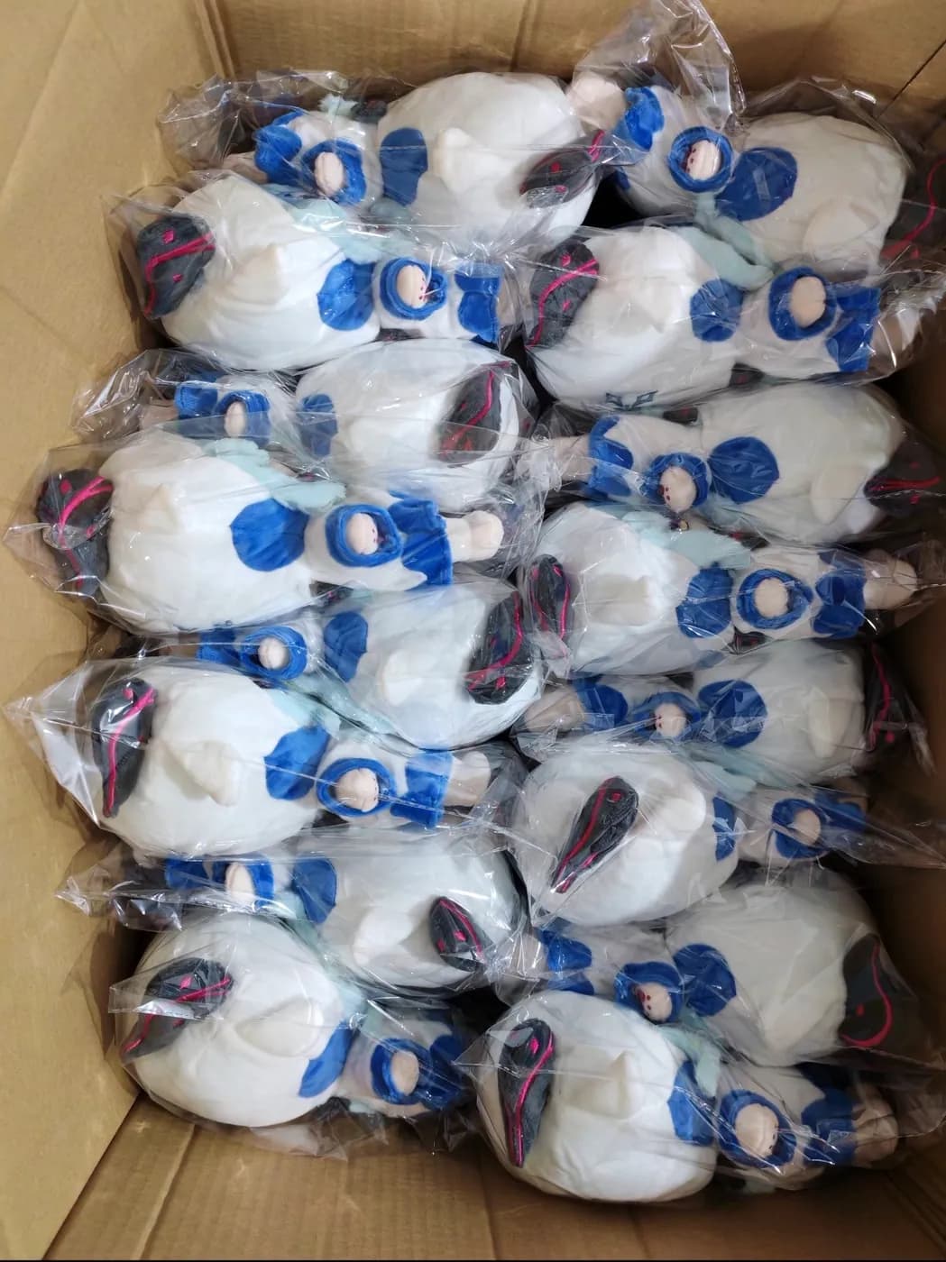 Production run of white plush toys bagged for inspection
