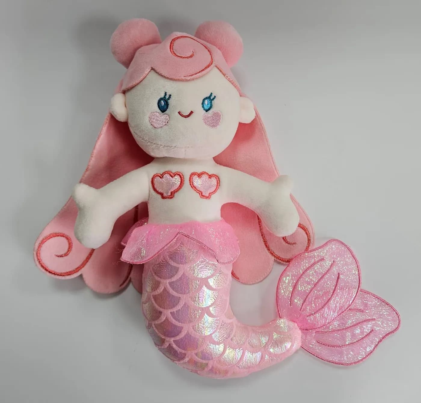 Mermaid character plush with an organza tail and appliqué hearts