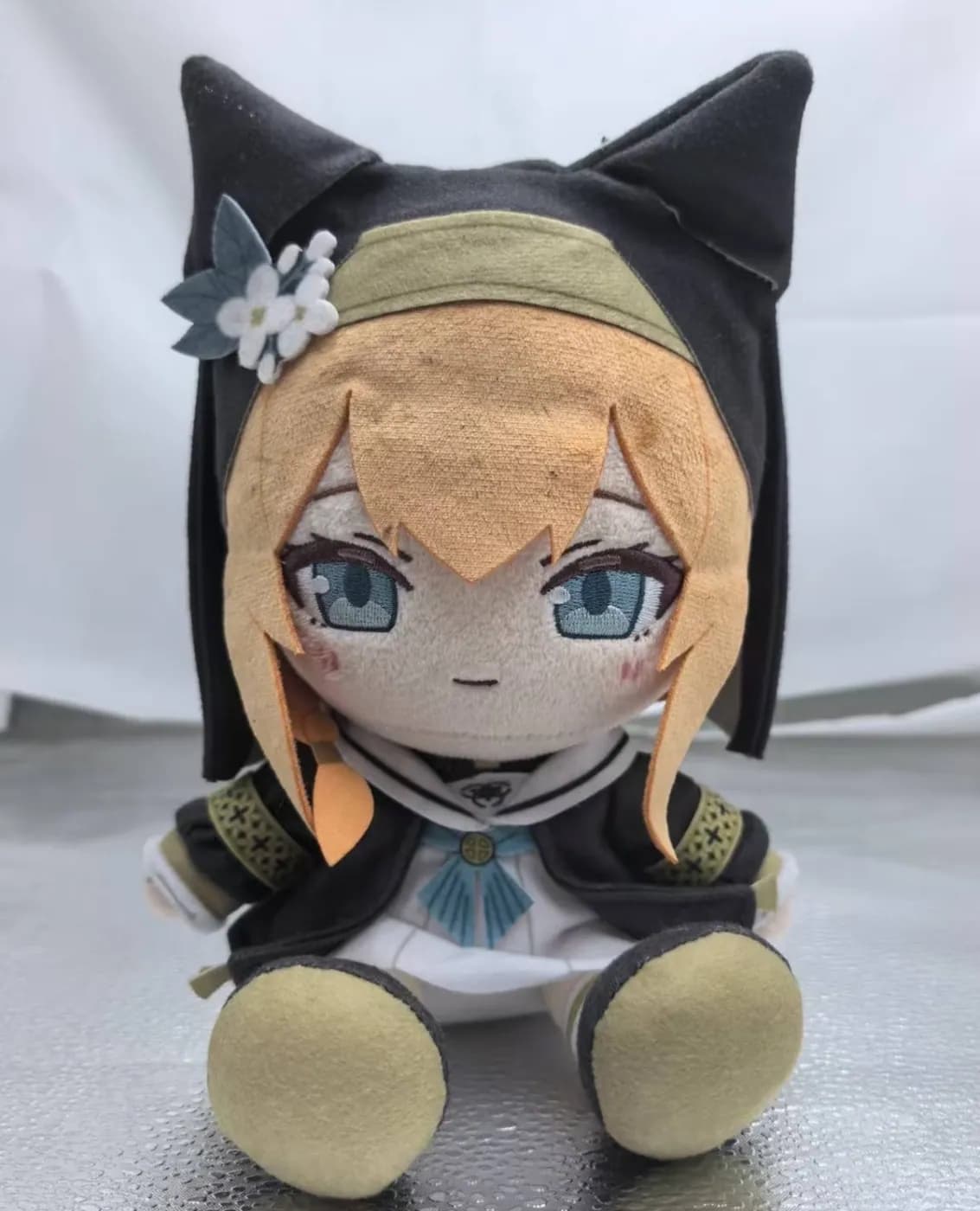 Cotton doll with a black hood outfit and wefted blonde hair