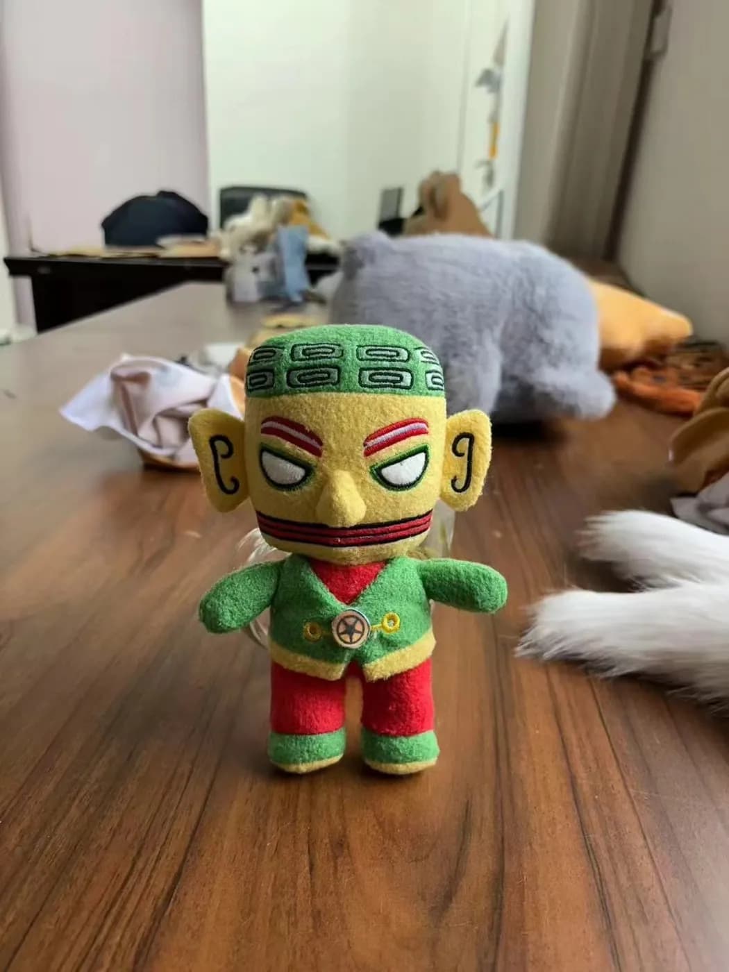 Costumed warrior character doll with printed robes and a moulded mask