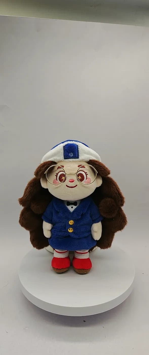Character doll in a navy uniform with moulded shoes