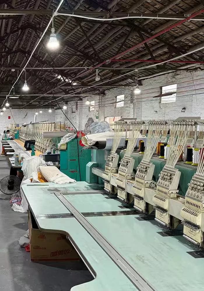 Row of multi-head embroidery machines running in our Shenzhen workshop