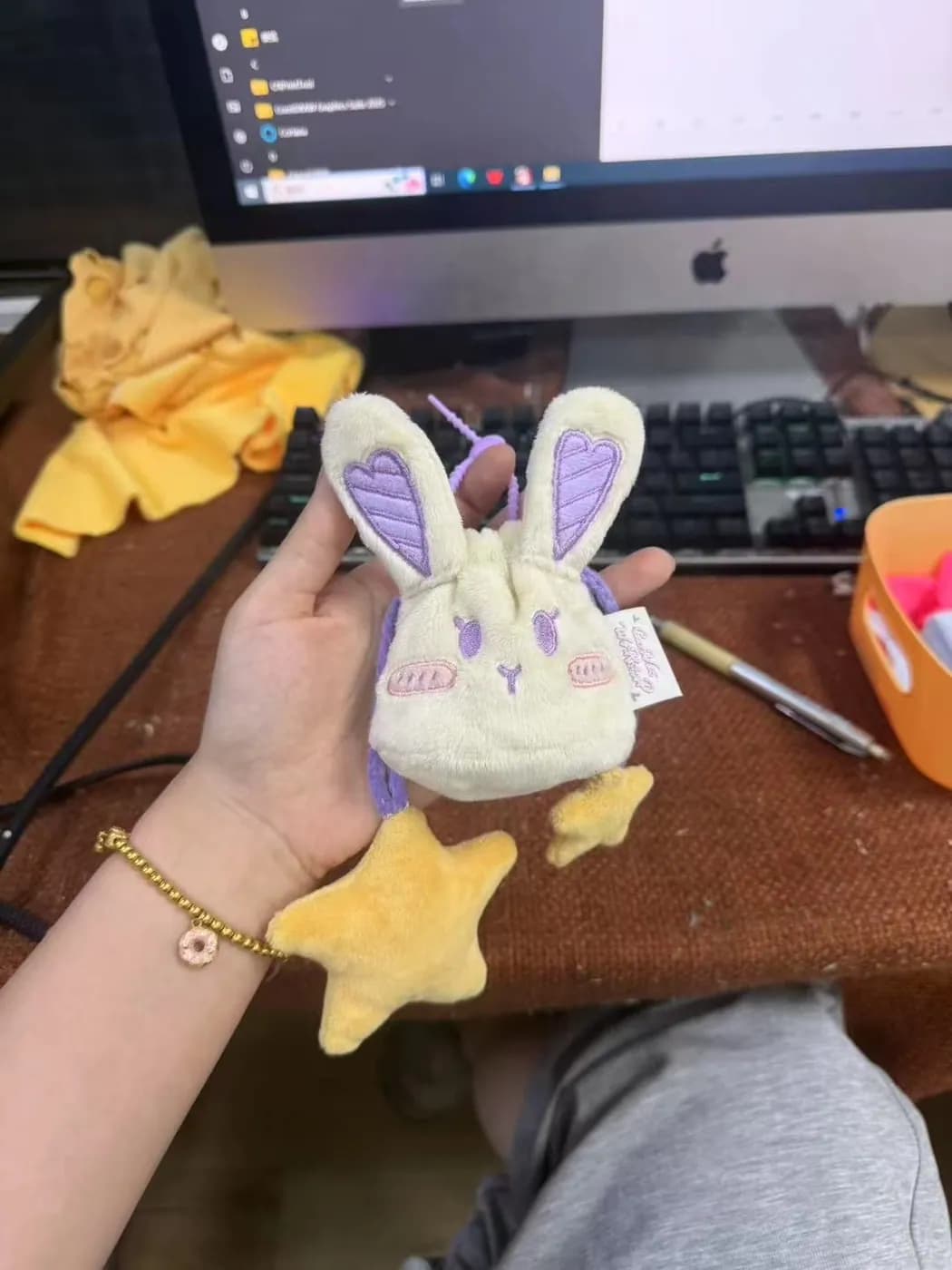 Lilac rabbit plush charm with printed ears and a star trim