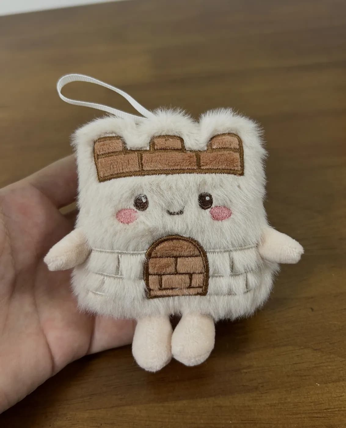 Watchtower plush charm with printed brickwork and a hanging loop
