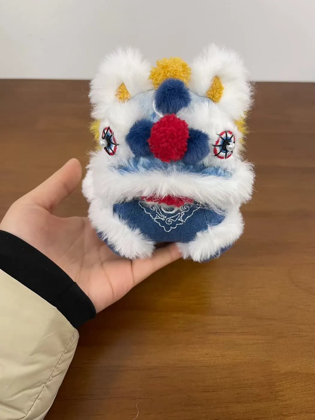 Blue and white lion dance head plush charm with long-pile trim
