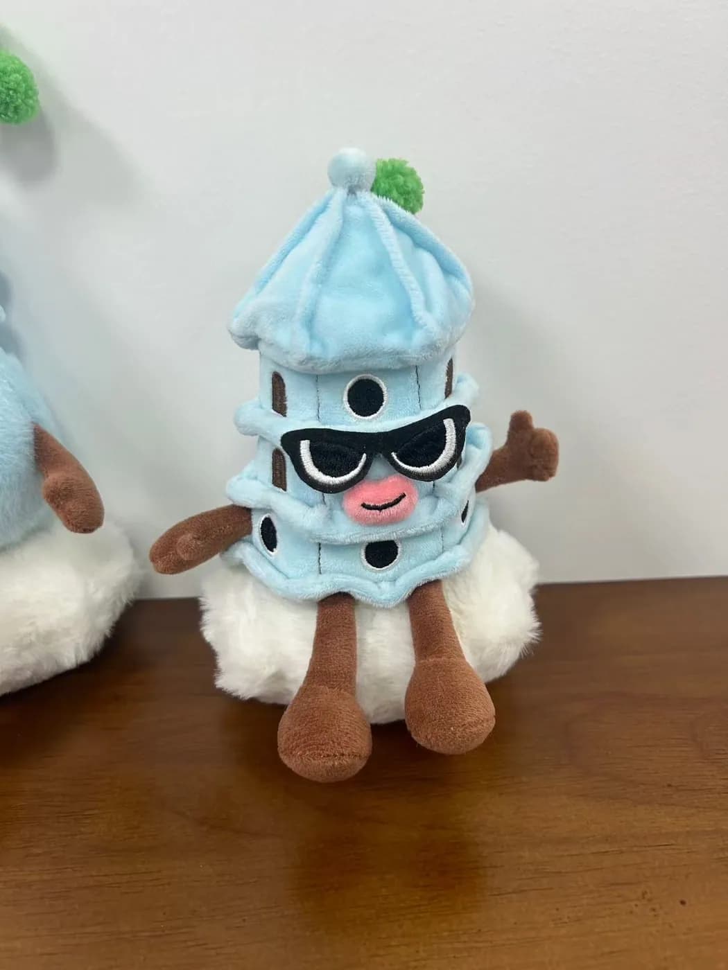 Pagoda character plush wearing appliqué sunglasses