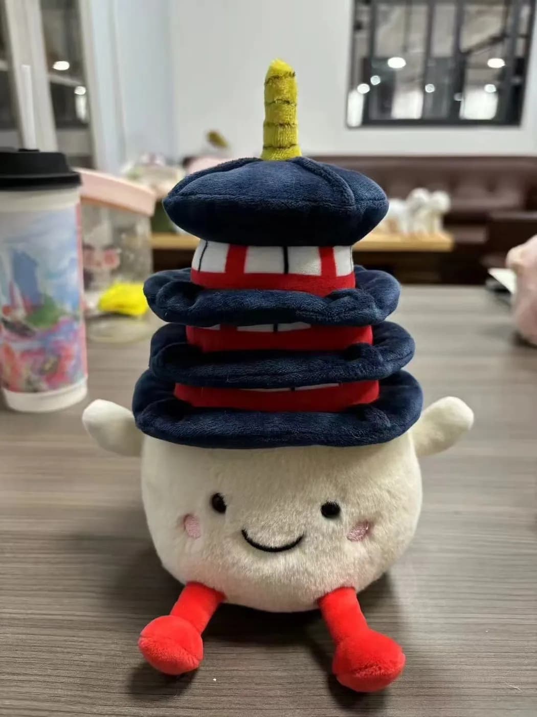 Tiered pagoda plush souvenir in navy and red with printed roof tiles