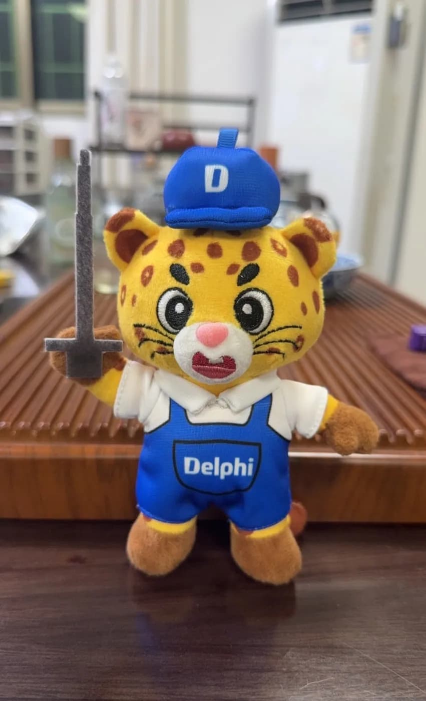 Corporate leopard mascot plush in a branded jersey and cap