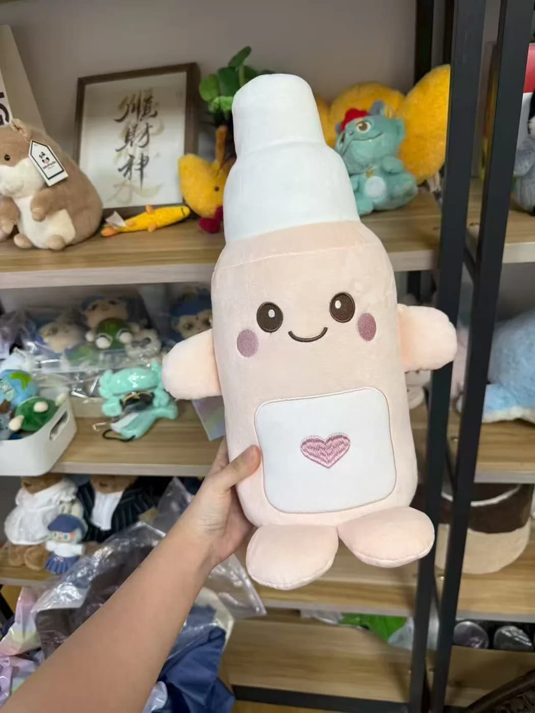 Bottle character plush with a printed label panel