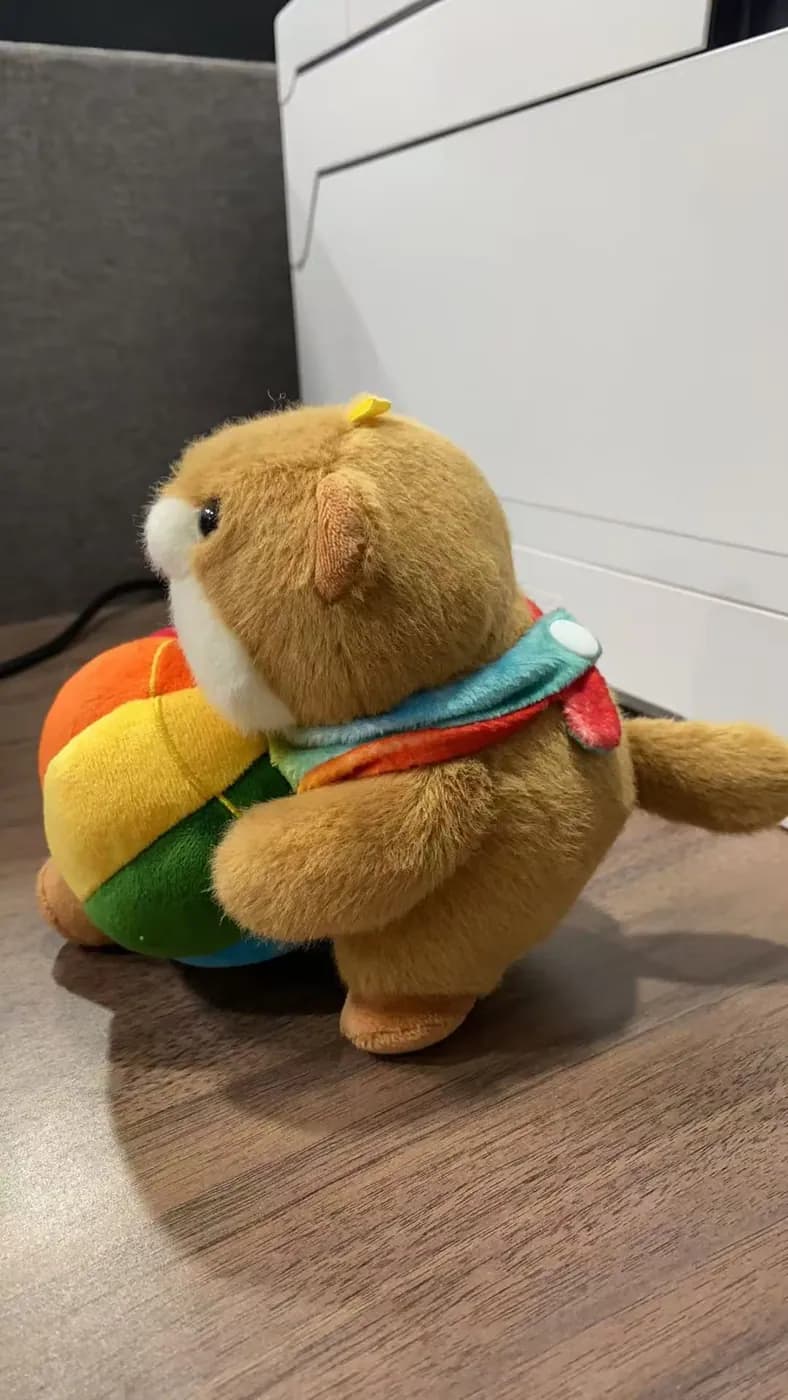 Capybara character plush dressed as a rolled snack