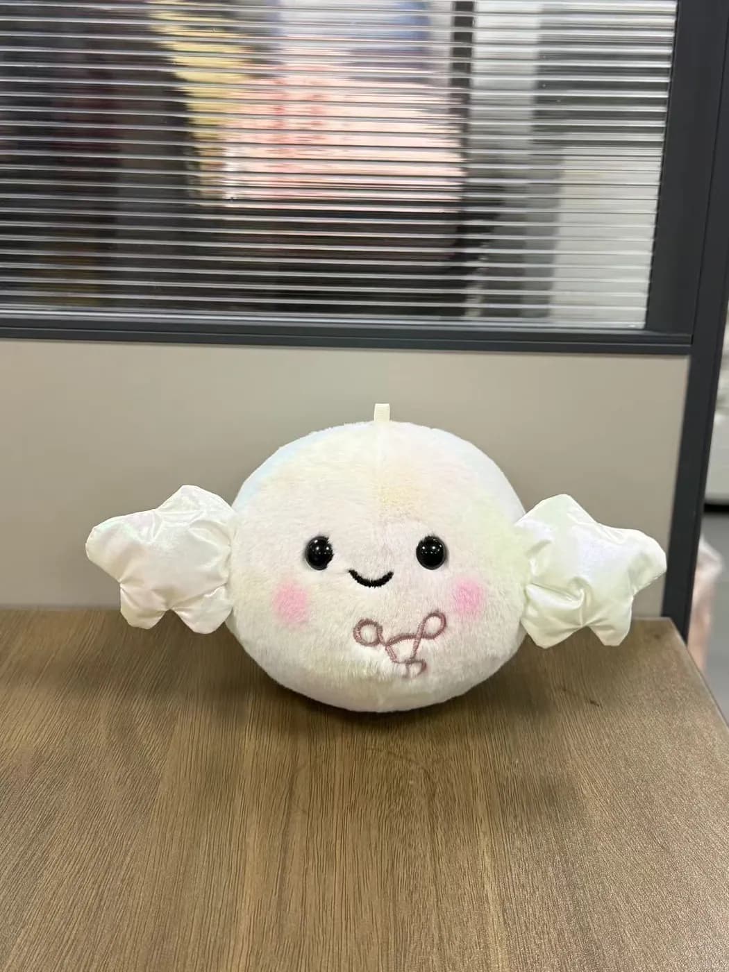 White dumpling character plush with felt wings and blushed cheeks