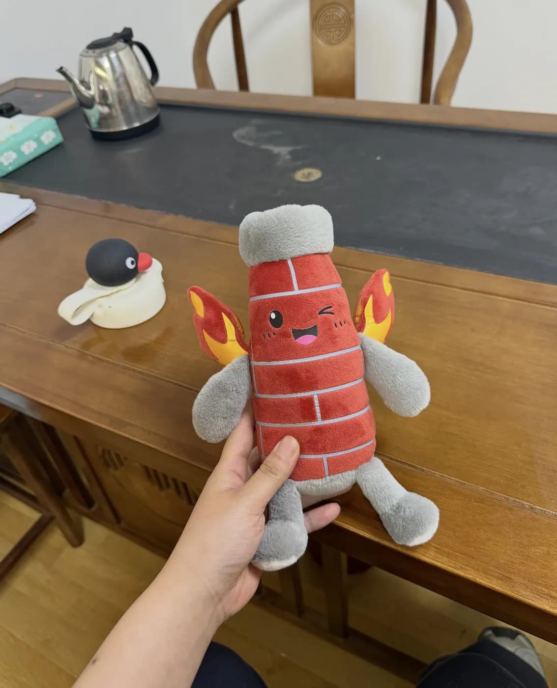 Firecracker character plush with printed brick texture