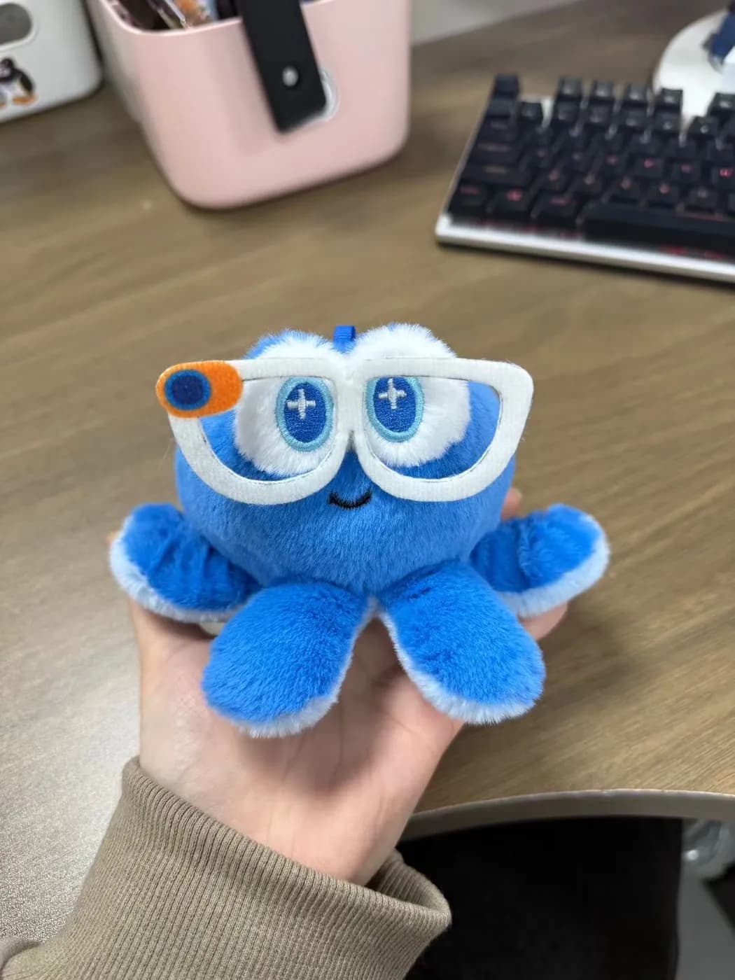 Blue octopus character plush wearing appliqué goggles
