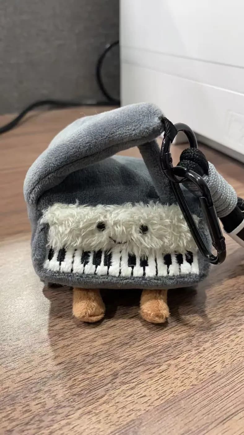 Piano keyboard plush shoulder bag with a printed keybed