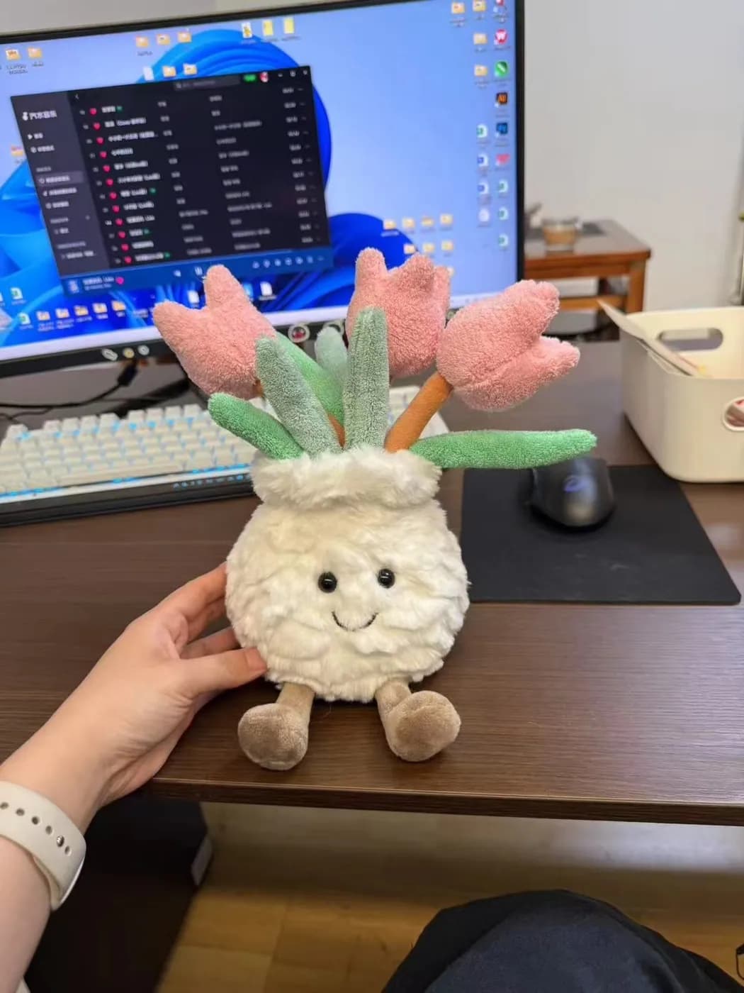 Plant character plush with fabric tulips growing from its head